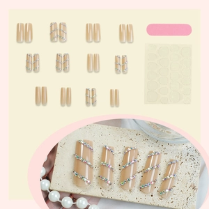 Long square nude press-on nails set with AB crystals and complete application tool kit