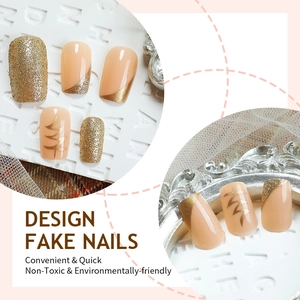Almond almond nude and gold press-on nails with glitter French tips and wavy metal details