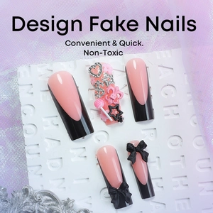 Pink and black long press-on nails with 3D bows and heart crystal decorations