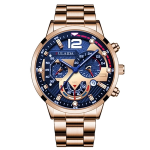 Close-up of rose gold men's chronograph watch with dark blue dial and metal link band
