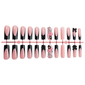 French tip press-on nails with 3D black bows and Y2K star charms in long square shape