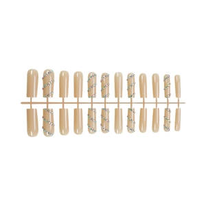 Long nude press-on nails with rainbow rhinestones and square tip false nail set
