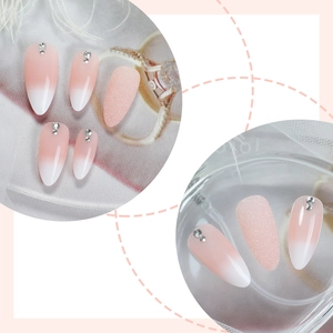 Pink ombre almond press-on nails with silver rhinestones and glitter finish