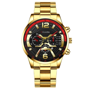 Detail of gold metal chronograph watch featuring black dial with tachymeter and sub-dials