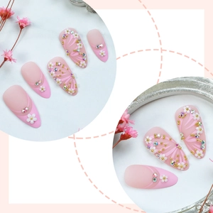 Pink gradient almond press-on nails with 3D resin flowers, butterfly and rhinestones