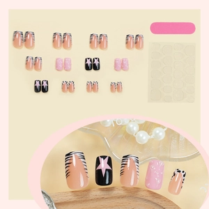 Short square press-on nails with pink star, cow print patterns and zebra stripe designs