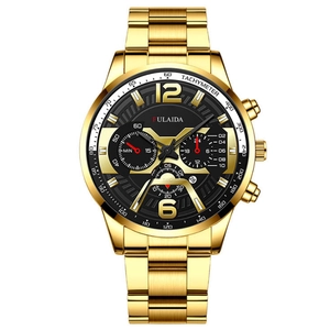 Detailed macro view of men's gold stainless steel chronograph watch with black dial