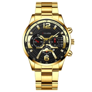 Macro detail of men's chronograph watch with black dial and gold tachymeter bezel