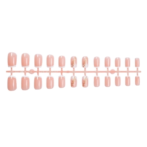 Short square press-on nails set in nude pink with white French tips and gold leaf patterns