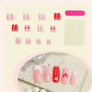 French tip press-on nails with red hearts and glitter, full manicure kit including file