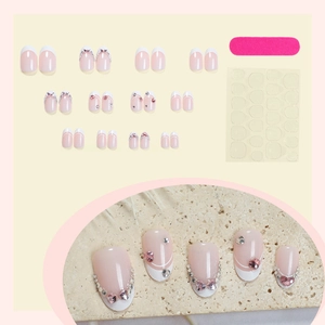 French tip press-on nail kit with pink heart rhinestones and 24 pieces of various sizes