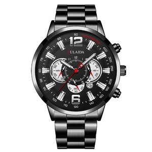 Detail of men's black chronograph watch with three sub-dials and date window