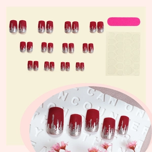 24-piece long press-on nail kit with red and silver glitter gradient and matte finish
