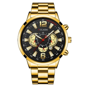 Detail view of gold men's chronograph watch featuring a black dial and date function