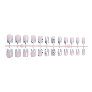 Short nude pink press-on nails set with silver flame patterns and rhinestone crosses