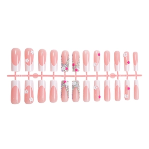 French press-on nails in pink and white with 3D flower accents and sparkling rhinestones