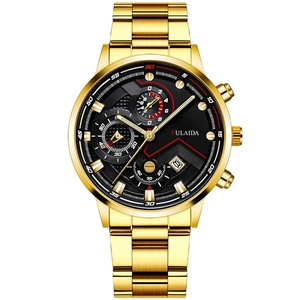 Close-up of gold stainless steel chronograph watch with black dial and calendar display