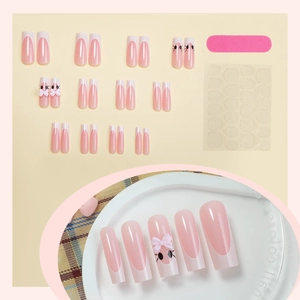Detailed set of 24 pink handmade press-on nails with 3D bows and adhesive tabs