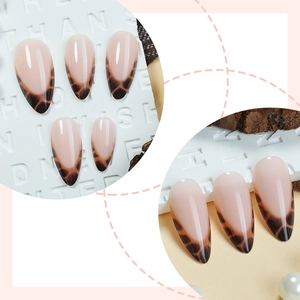 Long almond press-on nails featuring French leopard print design and high-gloss finish