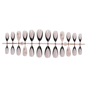 Faux ongles amande minimalistes avec pointes françaises noires et étoiles dorées