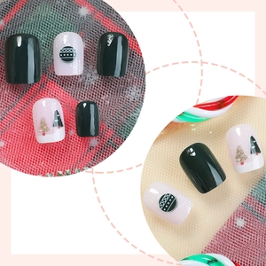 Short square Christmas press-on nails featuring dark green patterns and glitter trees