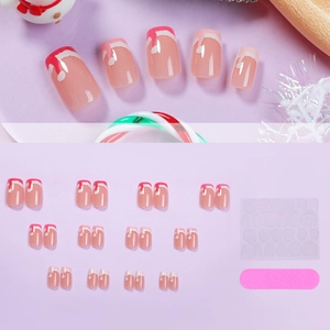 Christmas-themed press-on nail kit with Santa hat designs and complete accessories