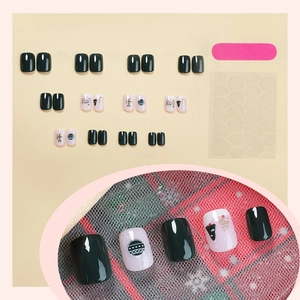 Short square press on nails with dark green Christmas tree and Joy lettering design