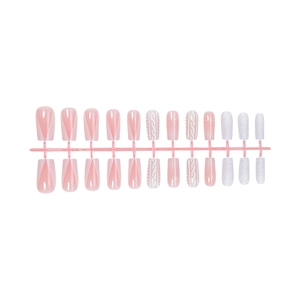 Faux ongles Noël rose et blanc avec texture pull et motifs flocons de neige