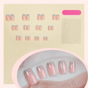 Silver glitter French press-on nails with white bow designs and application kit