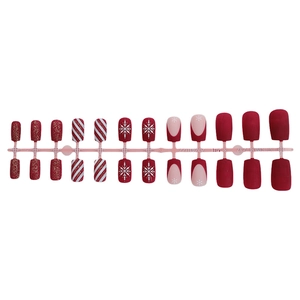 Christmas red glitter and snowflake pattern press-on nail set on a plastic holder
