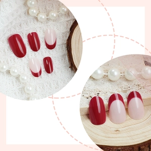 French oval press-on nails in deep red and nude pink with a high-gloss finish