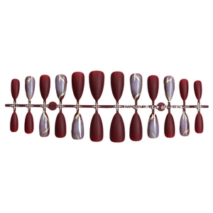 Matte burgundy and purple marble press-on nails with gold glitter lines on a set