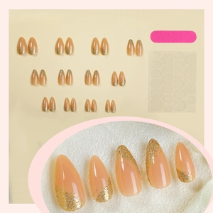 Almond press-on nails with pink base and gold glitter french design including tool kit