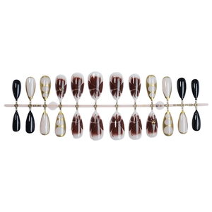 Almond press-on nails set with black white floral patterns and gold line details