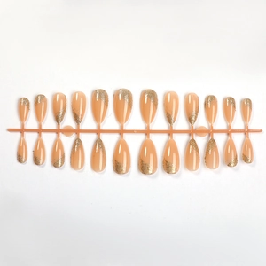 Almond press-on nails with nude pink base and gold glitter lines, 24-piece full set on stand