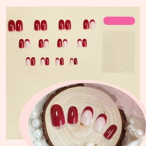 Classic dark red French oval press-on nails set with glossy finish and tools