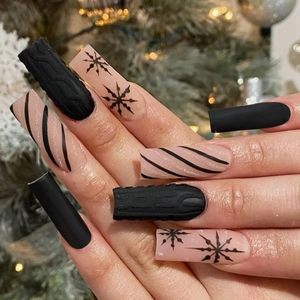 Christmas press-on nails featuring black 3D sweater texture and snowflake designs