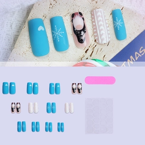 Christmas press-on nails set with blue snowflake patterns and 3D white sweater texture