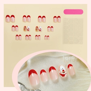 Short oval Christmas press-on nails set with Santa and Gingerbread Man hand-painted designs