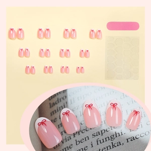 Pink jelly French press-on nails set with red bows and white tips, including 24 pieces