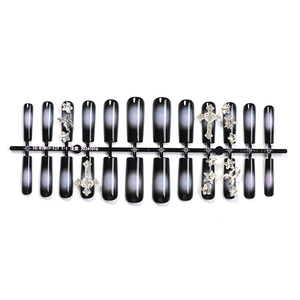 Gothic press-on nails featuring black and grey gradient with silver cross and star studs