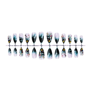Deep green marble press-on nails set with 3D star charms and rhinestones