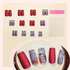 Christmas themed aurora red press-on nails with snowflake and snowman designs