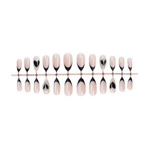 Pink and black almond false nails set with heart rhinestones and french tip designs