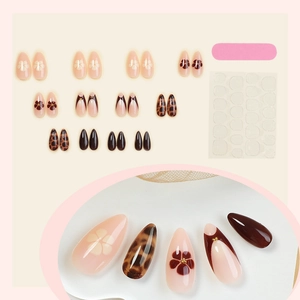 Leopard print almond press-on nails set with brown French tips and floral accents