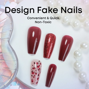 Burgundy French cat-eye press-on nails with leopard patterns and glitter on a white stand