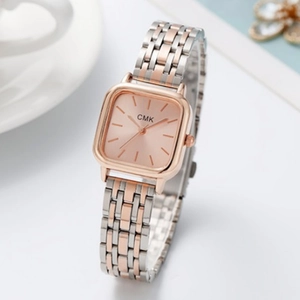 Detail of rose gold and silver square dial watch with luxury steel bracelet and CMK logo