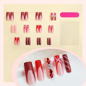 Christmas red press-on nails set with glitter, french tips, and rhinestone accents