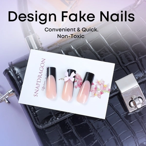 French black tip press-on nails with 3D pink bow accents on long ballet shape tips