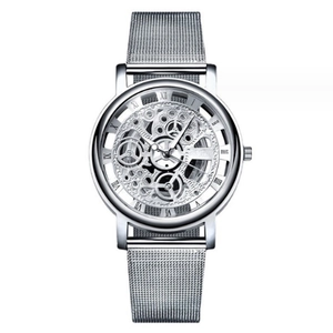Macro shot of silver skeleton watch dial with Roman numerals and Milanese mesh steel strap